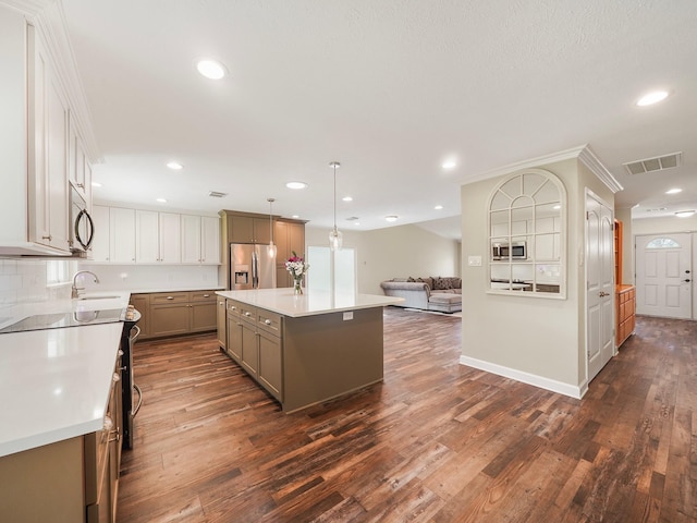 kitchen with dark wood-style flooring, stainless steel appliances, recessed lighting, visible vents, and open floor plan