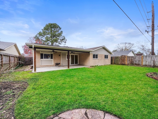 rear view of house featuring a ceiling fan, brick siding, a patio, and a fenced backyard