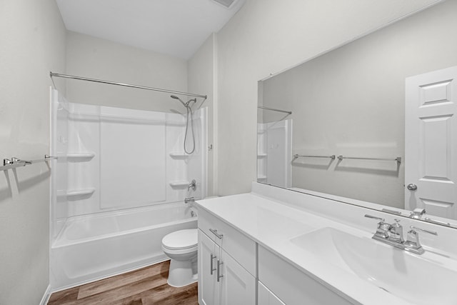 full bathroom with vanity,  shower combination, wood finished floors, and toilet