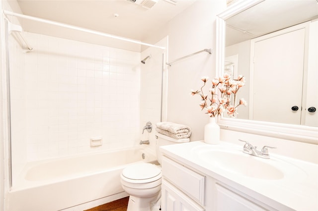 bathroom featuring toilet,  shower combination, and vanity