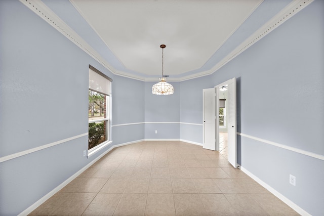 tiled spare room with baseboards, crown molding, and an inviting chandelier