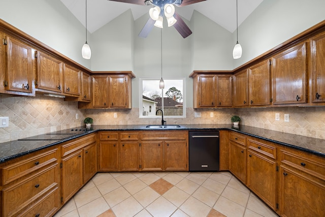 kitchen with black appliances, brown cabinetry, and a sink