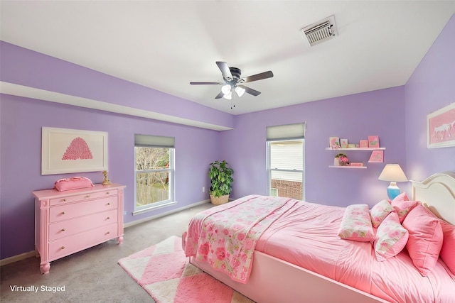 carpeted bedroom with baseboards, visible vents, and ceiling fan