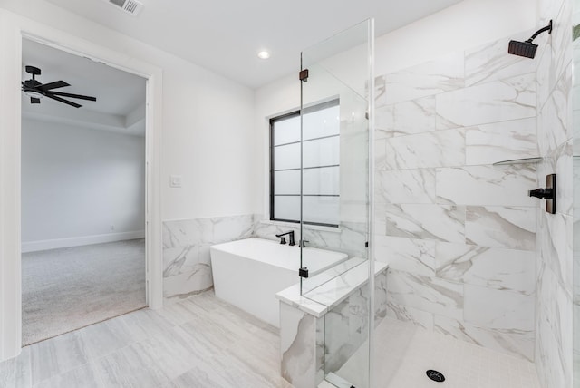 full bathroom featuring tile walls, a marble finish shower, recessed lighting, a ceiling fan, and a freestanding tub