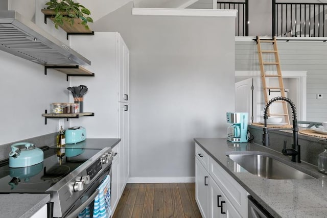 kitchen with extractor fan, a sink, white cabinetry, stainless steel range with electric cooktop, and dark wood-style floors