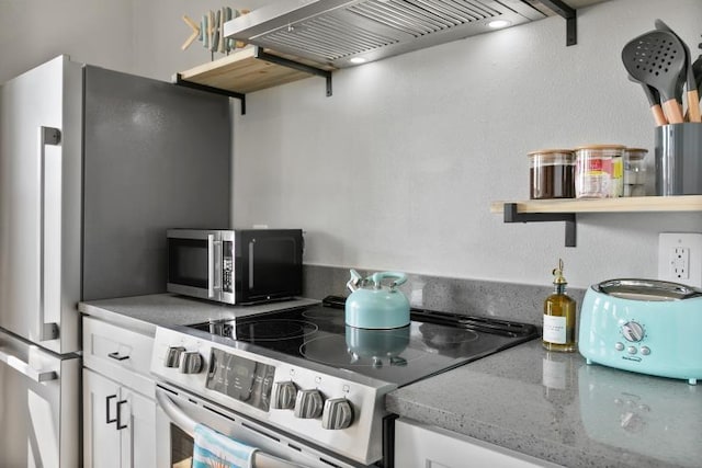 kitchen with open shelves, appliances with stainless steel finishes, custom exhaust hood, and white cabinets