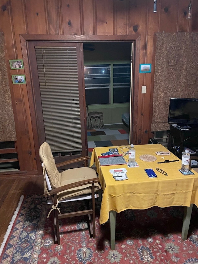 dining area with wooden walls