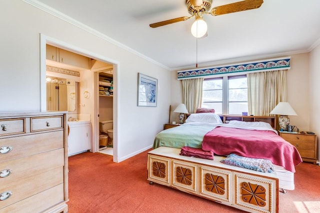 carpeted bedroom featuring ceiling fan, ornamental molding, ensuite bath, and baseboards