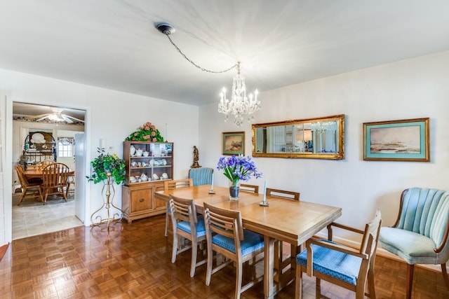 dining space featuring an inviting chandelier