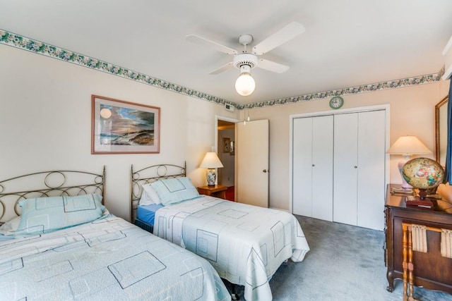 carpeted bedroom featuring a ceiling fan and a closet