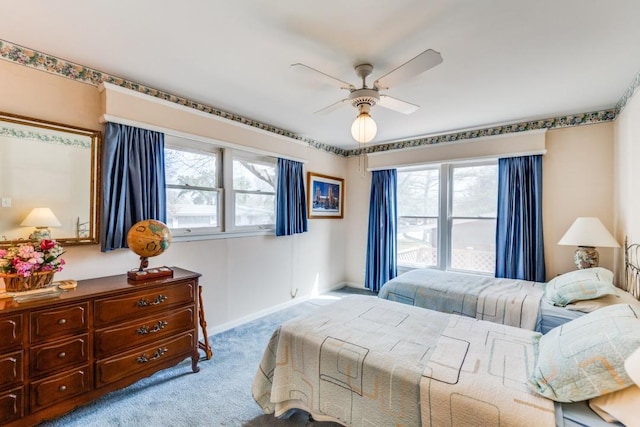 bedroom with carpet flooring, a ceiling fan, and baseboards