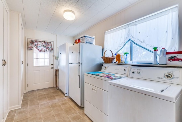 clothes washing area with laundry area and separate washer and dryer