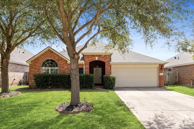 view of front of property with a garage, concrete driveway, roof with shingles, a front lawn, and brick siding