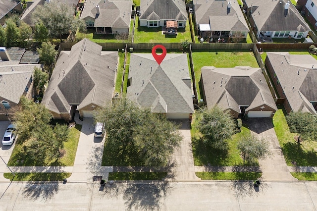 birds eye view of property with a residential view