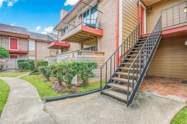 doorway to property featuring brick siding