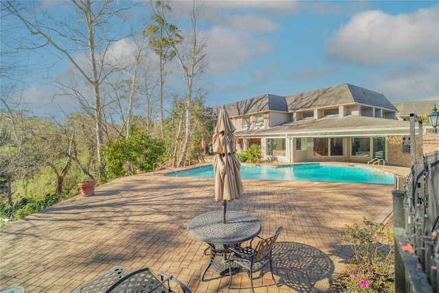 pool with a patio