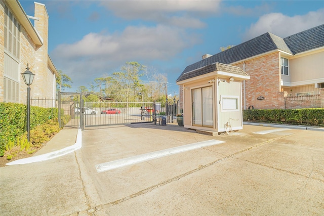 exterior space with fence and a gate