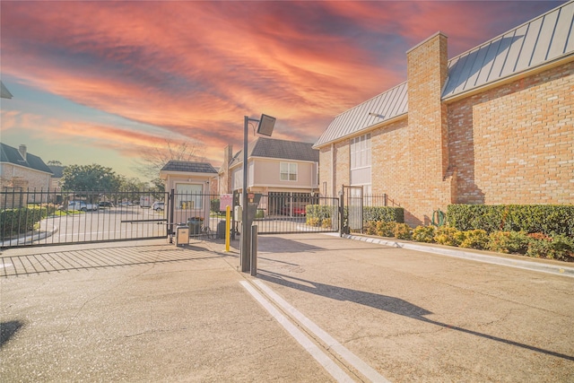 view of street featuring a gate and a gated entry