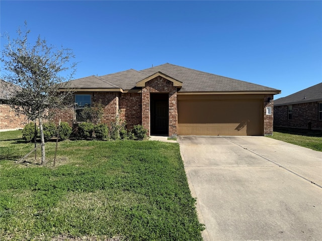 view of front facade with a garage, a front yard, and brick siding