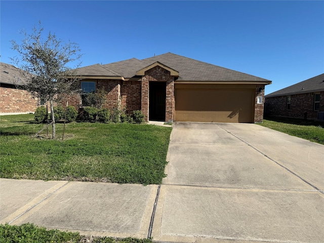 view of front of property featuring a front yard, concrete driveway, brick siding, and an attached garage