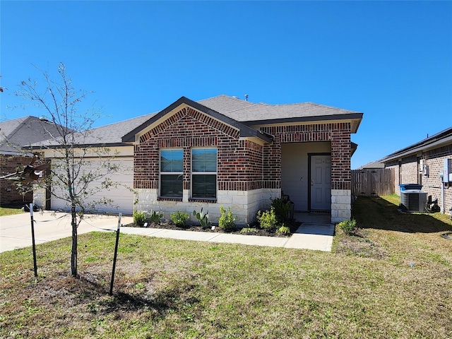 view of front of house with brick siding, an attached garage, central AC, driveway, and a front lawn