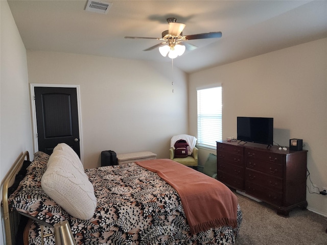 bedroom with ceiling fan, visible vents, and carpet flooring