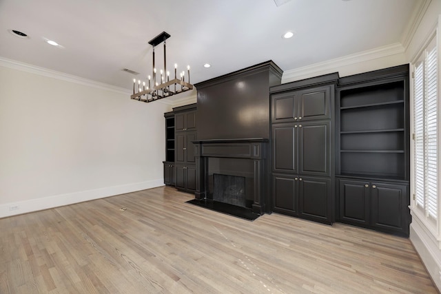 unfurnished living room featuring light wood-style floors, visible vents, a wealth of natural light, and ornamental molding