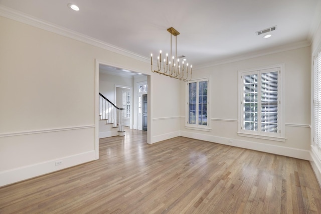 unfurnished dining area with visible vents, crown molding, stairway, and light wood finished floors