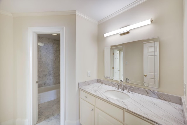 bathroom with ornamental molding and vanity