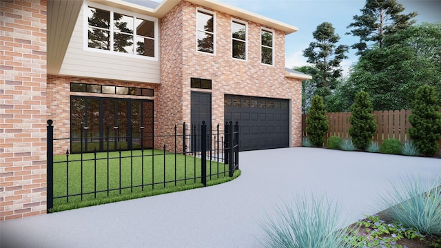 view of front of house with a fenced front yard, a garage, brick siding, driveway, and a front lawn