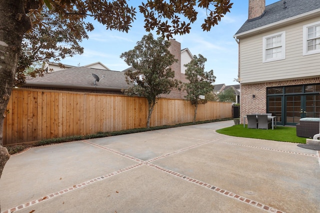 view of patio with cooling unit and fence