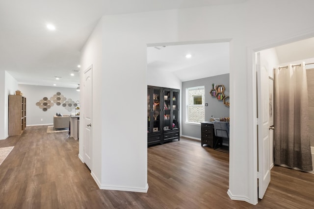 hallway with recessed lighting, baseboards, and wood finished floors