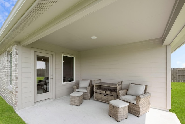 view of patio / terrace featuring fence