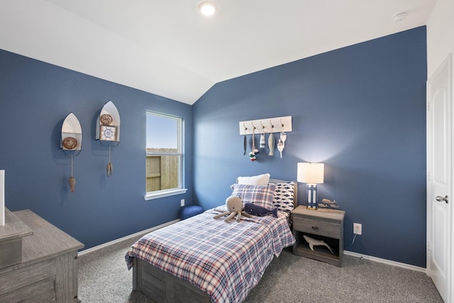 bedroom featuring carpet, baseboards, and vaulted ceiling