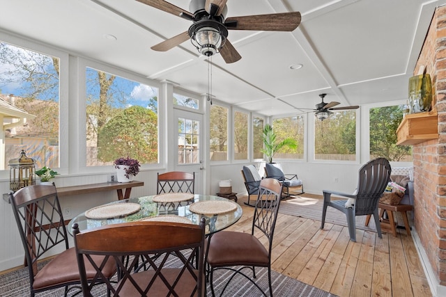 sunroom with a wealth of natural light and ceiling fan