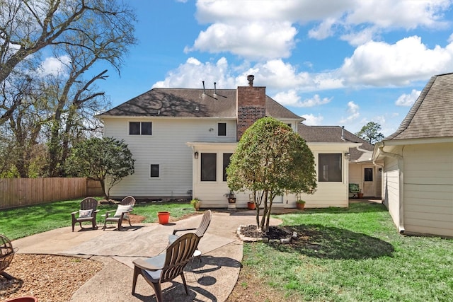 17302 Loring Ln, Spring, TX 77388 - back of house featuring a patio, a chimney, and roof with shingles