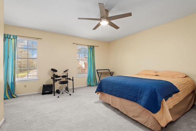 bedroom with carpet, baseboards, and ceiling fan