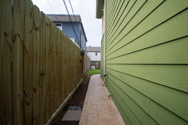 view of home's exterior with fence