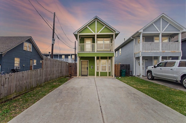 view of front of property featuring fence