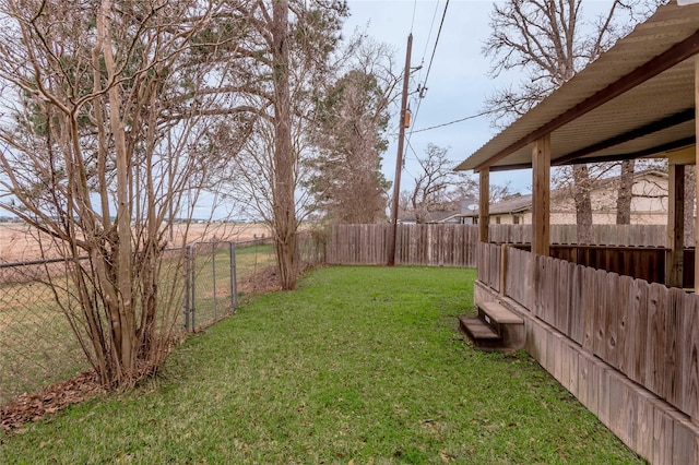 view of yard with a fenced backyard