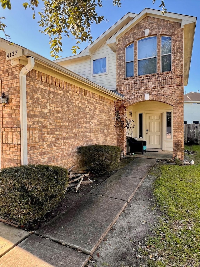 view of front of house featuring brick siding