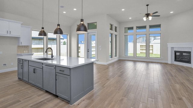 21207 Palm Arbor Dr, Cypress, TX 77433 - kitchen featuring open floor plan, gray cabinetry, dishwasher, light countertops, and recessed lighting