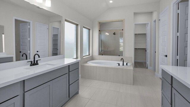 21207 Palm Arbor Dr, Cypress, TX 77433 - bathroom with a spacious closet, vanity, a shower stall, vaulted ceiling, and recessed lighting