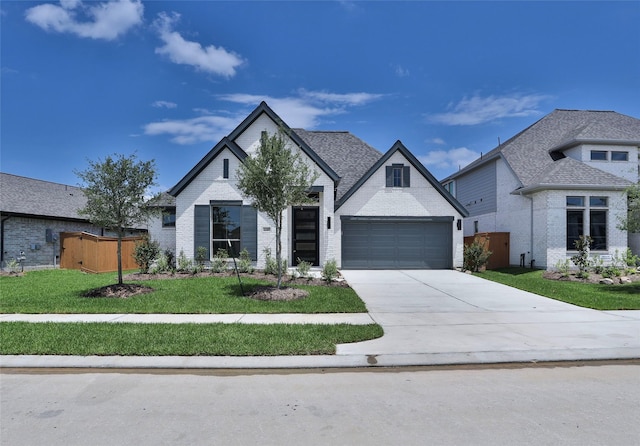 21207 Palm Arbor Dr, Cypress, TX 77433 - french country style house featuring driveway, brick siding, and a garage