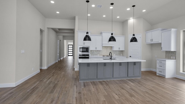 21207 Palm Arbor Dr, Cypress, TX 77433 - kitchen featuring oven, built in microwave, light countertops, backsplash, and recessed lighting