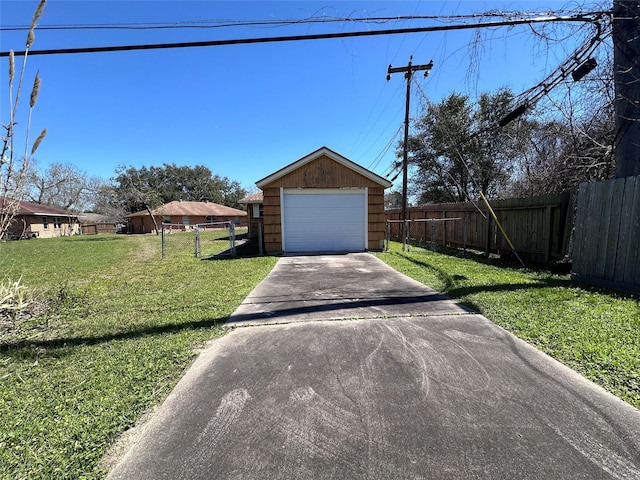 exterior space featuring concrete driveway and fence