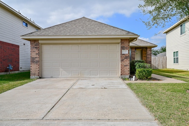 ranch-style home with brick siding, driveway, and roof with shingles