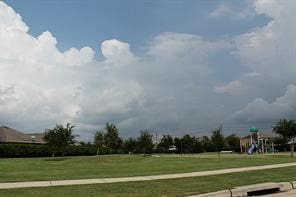 view of community featuring a lawn