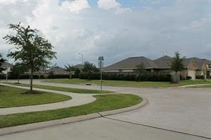 surrounding community featuring a lawn