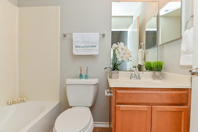 full bath featuring bathing tub / shower combination, toilet, and vanity